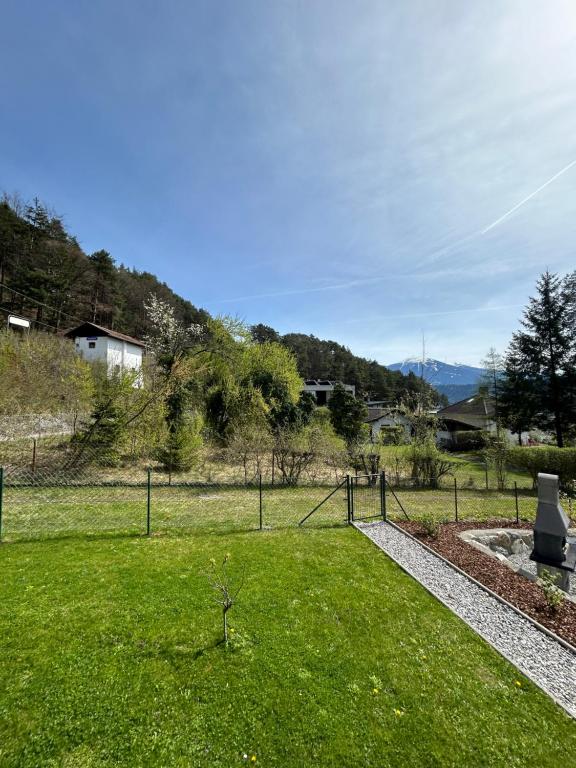 a park with a field of green grass at Wohnung mit Garten und Panoramablick in Innsbruck in Innsbruck