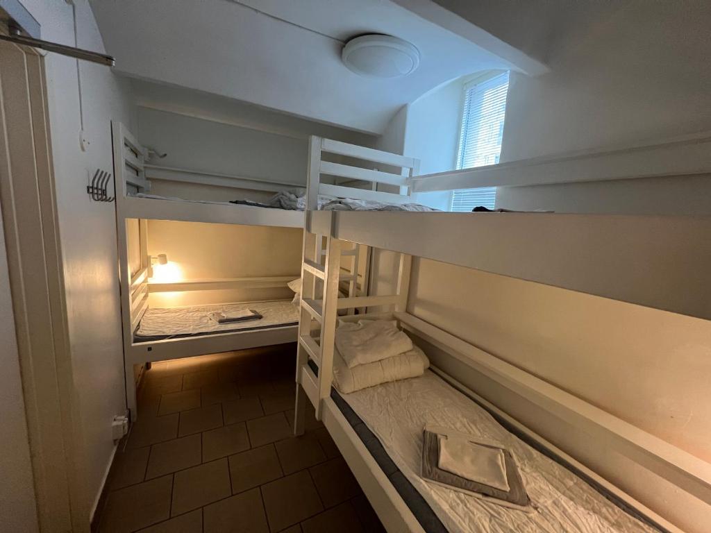 a room with two bunk beds in a room at Hostel Dalagatan in Stockholm