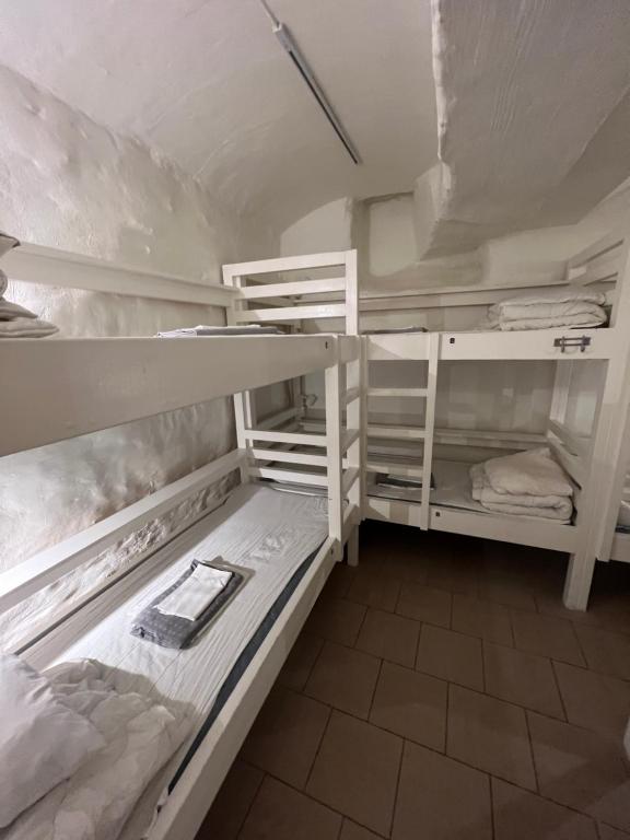 a room with two bunk beds in a room at Hostel Dalagatan in Stockholm