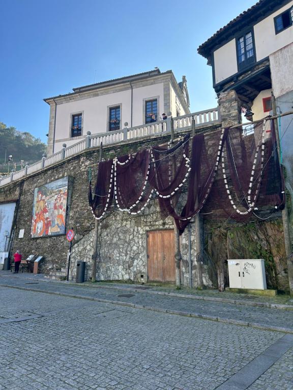 a building with christmas decorations on the side of it at Del Valle 1 in Cudillero