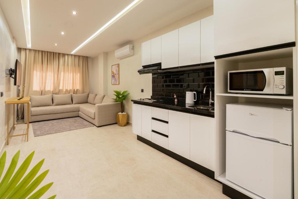 Kuchyň nebo kuchyňský kout v ubytování Appart Hôtel Rambla