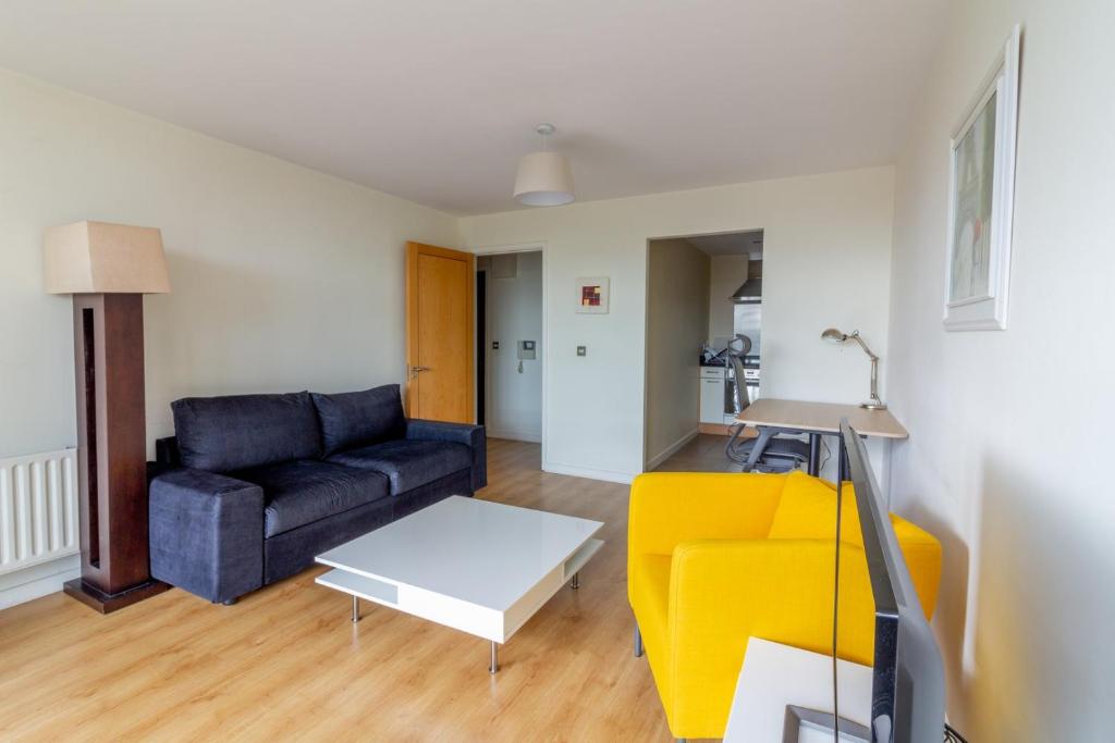 a living room with a couch and a table at GuestReady - Luminous Elegance in Barrow Street in Dublin