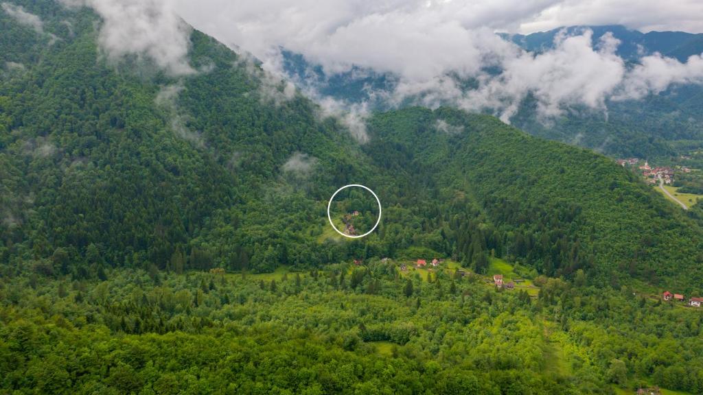 an aerial view of a mountain with a house in the middle at Holiday house Kajfes in Brod na Kupi
