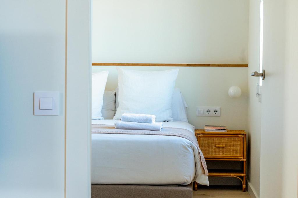 En eller flere senge i et værelse på Factory Apartments Barcelona