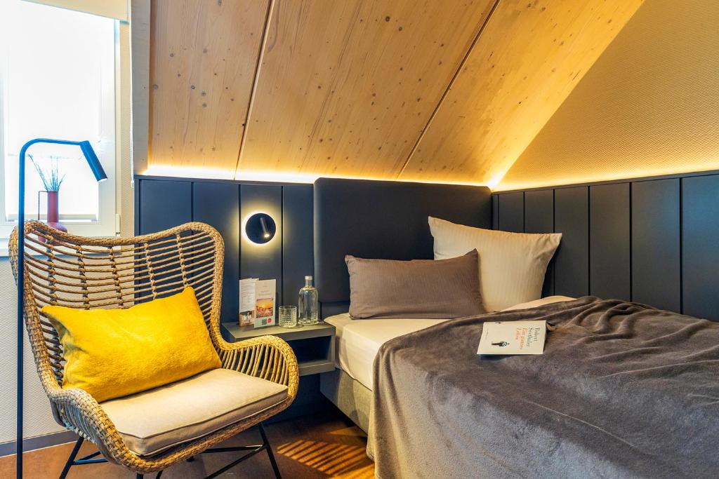 Postel nebo postele na pokoji v ubytování Arthotel Bakker
