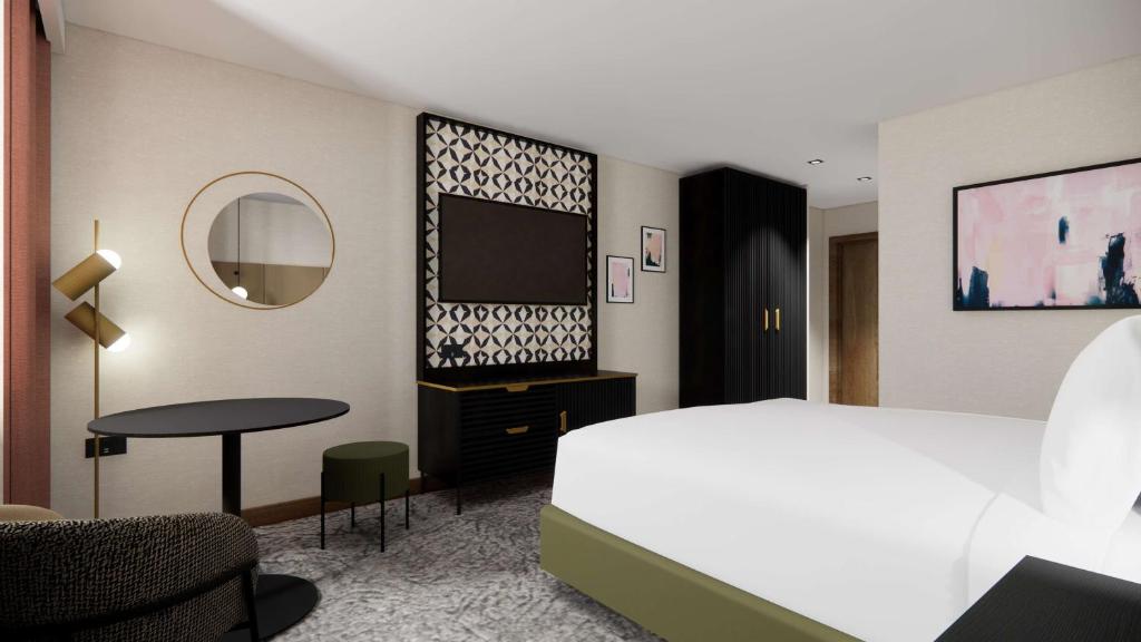 A bed or beds in a room at Doubletree By Hilton Sheffield City