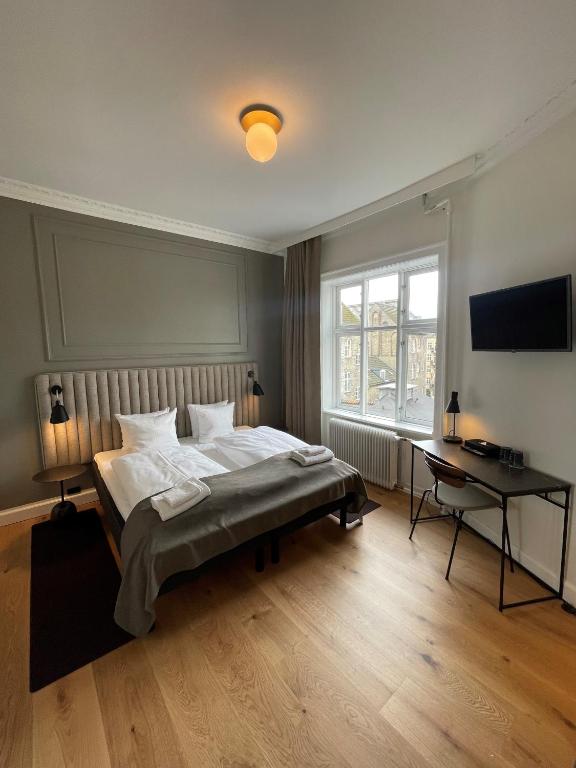Postel nebo postele na pokoji v ubytování Hotel Sct. Thomas