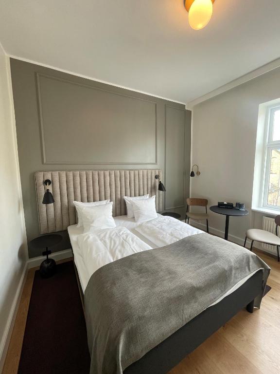 Postel nebo postele na pokoji v ubytování Hotel Sct. Thomas