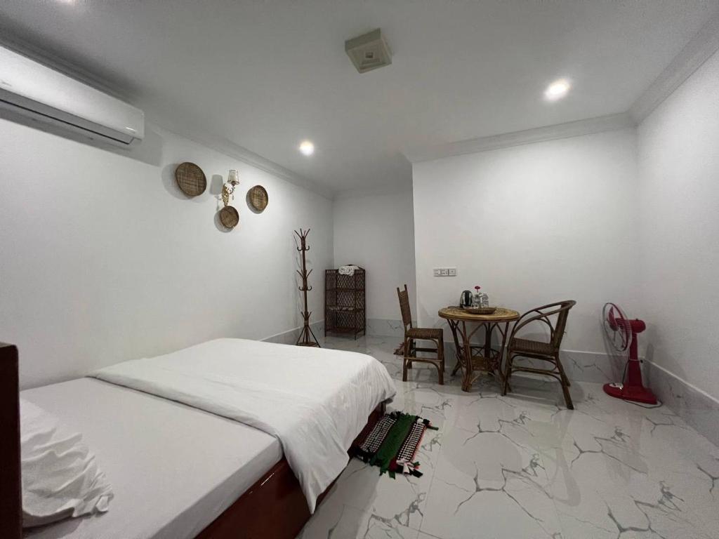 Postel nebo postele na pokoji v ubytování El Ling guesthouse