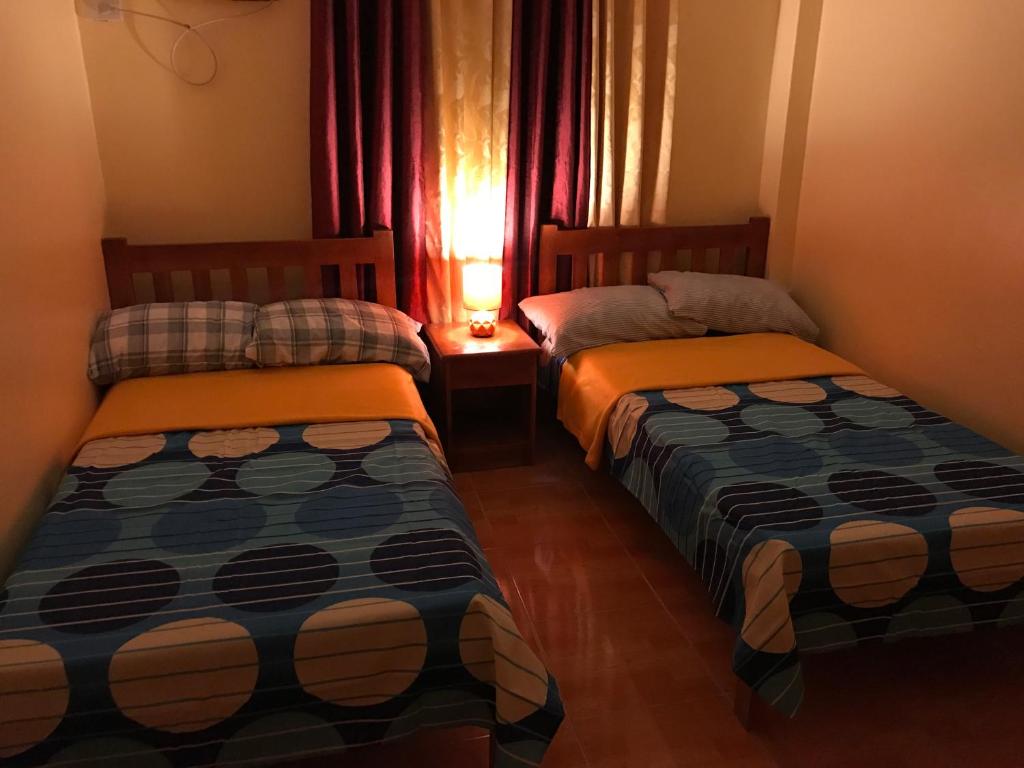 Voodi või voodid majutusasutuse TGH Guest House Badian toas