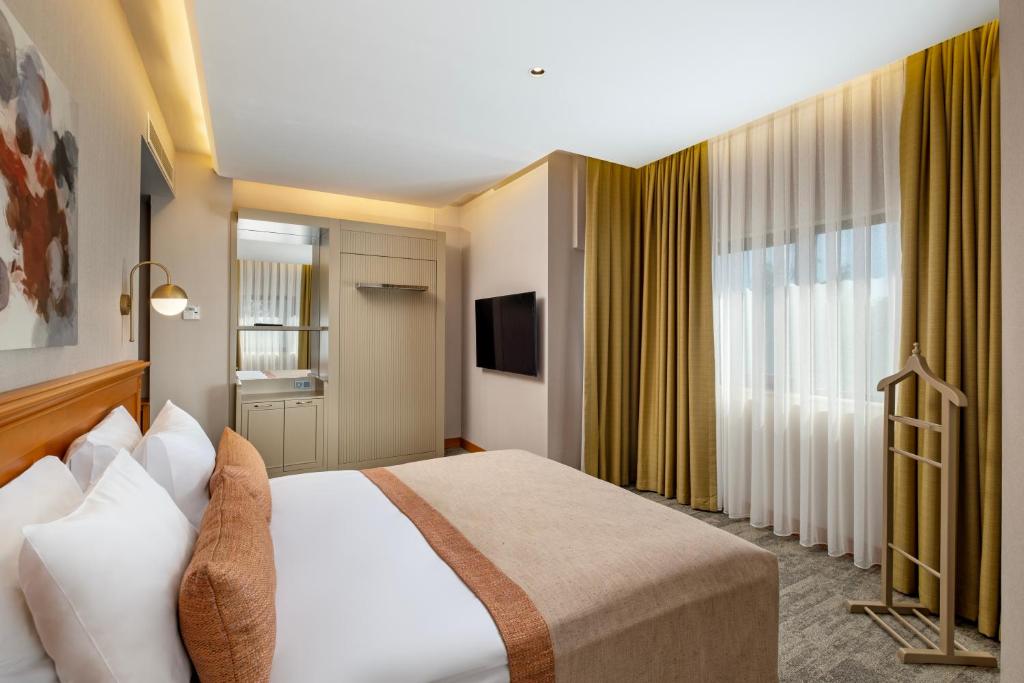 Postel nebo postele na pokoji v ubytování Limak Limra Hotel & Resort Kemer - Kids Concept