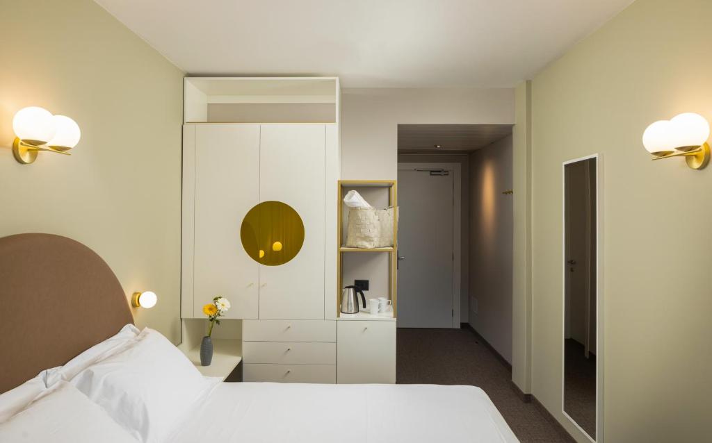 Postel nebo postele na pokoji v ubytování Hotel Nettuno