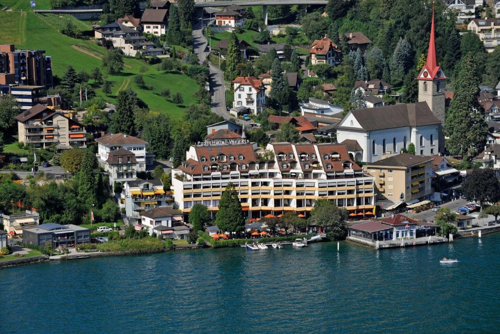 an aerial view of a town on the river at Post Hotel Weggis in Weggis