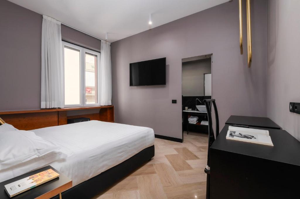 Postel nebo postele na pokoji v ubytování Hotel Valerì
