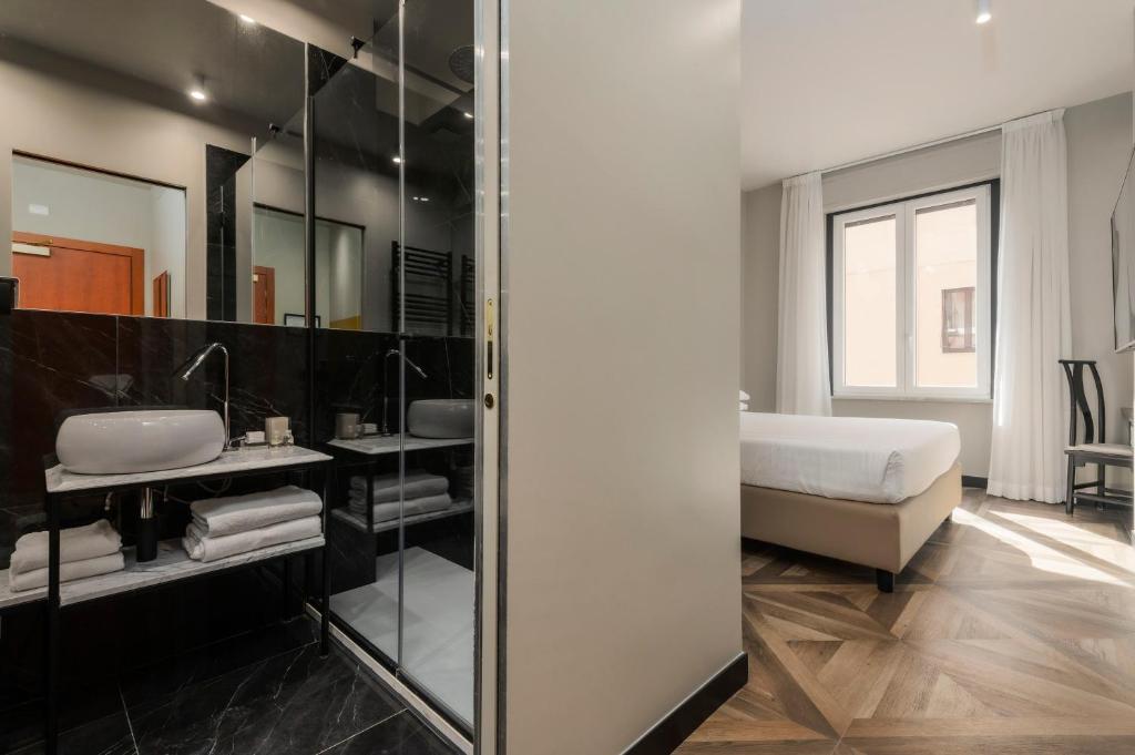 Postel nebo postele na pokoji v ubytování Hotel Valerì