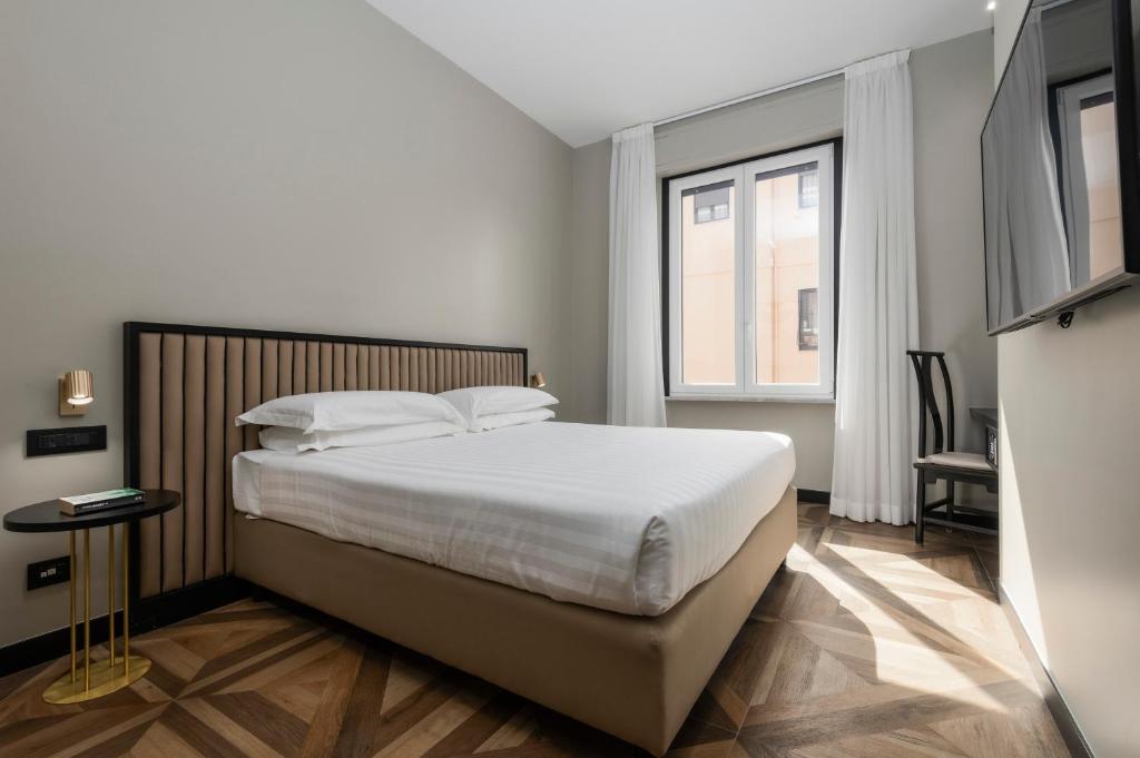 Postel nebo postele na pokoji v ubytování Hotel Valerì