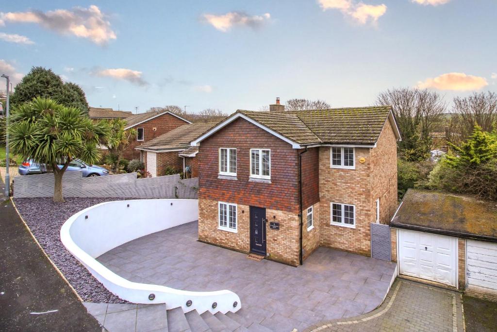 a large brick house with a large backyard at Wanderdown House near the Beach with ample Free Parking in Rottingdean
