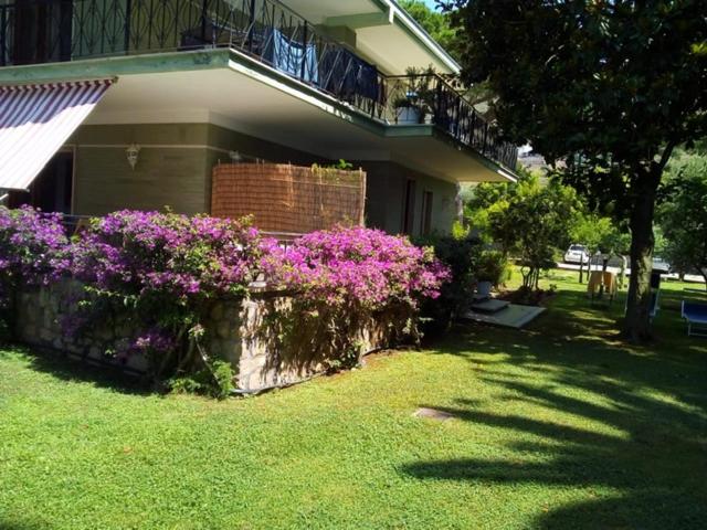 a house with purple flowers on the side of it at Villa Luisa B&B in Sperlonga