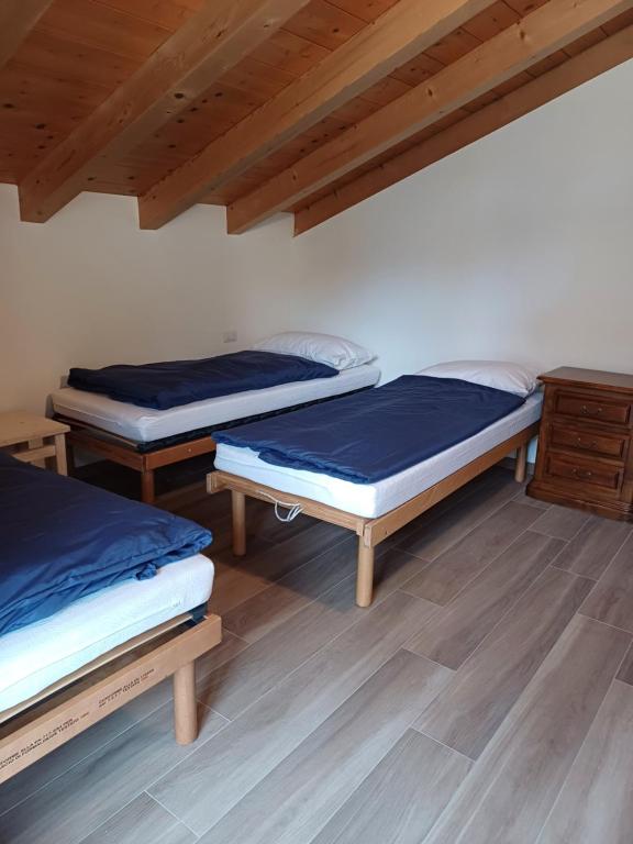 Postel nebo postele na pokoji v ubytování Casa Bresadola - Pellizzano