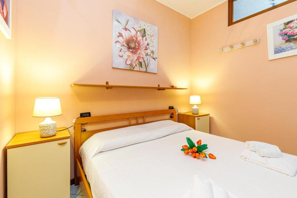 Posteľ alebo postele v izbe v ubytovaní Magnolia Sirmione 500m from lake Garda - Happy Rentals