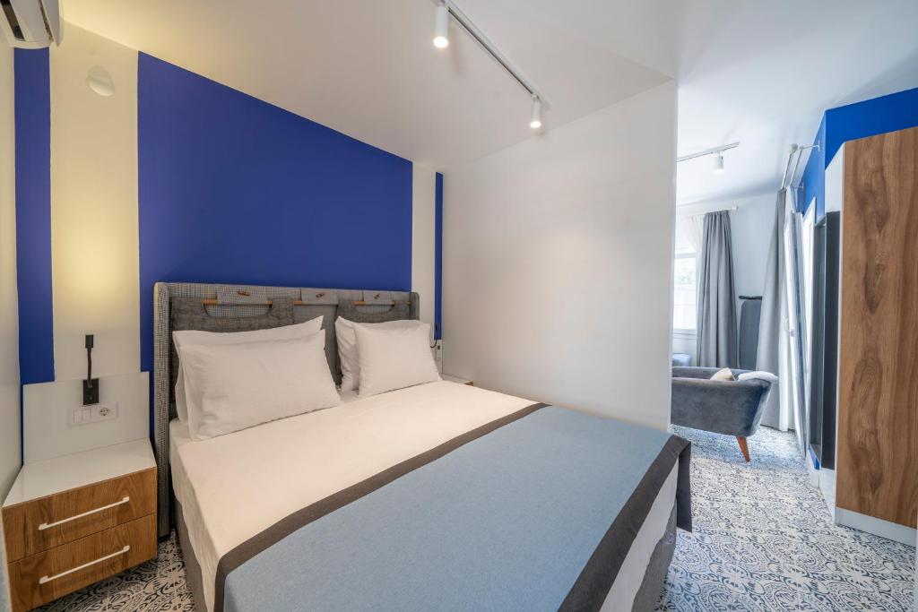 Postel nebo postele na pokoji v ubytování Noa Suite Hotel Only Adult