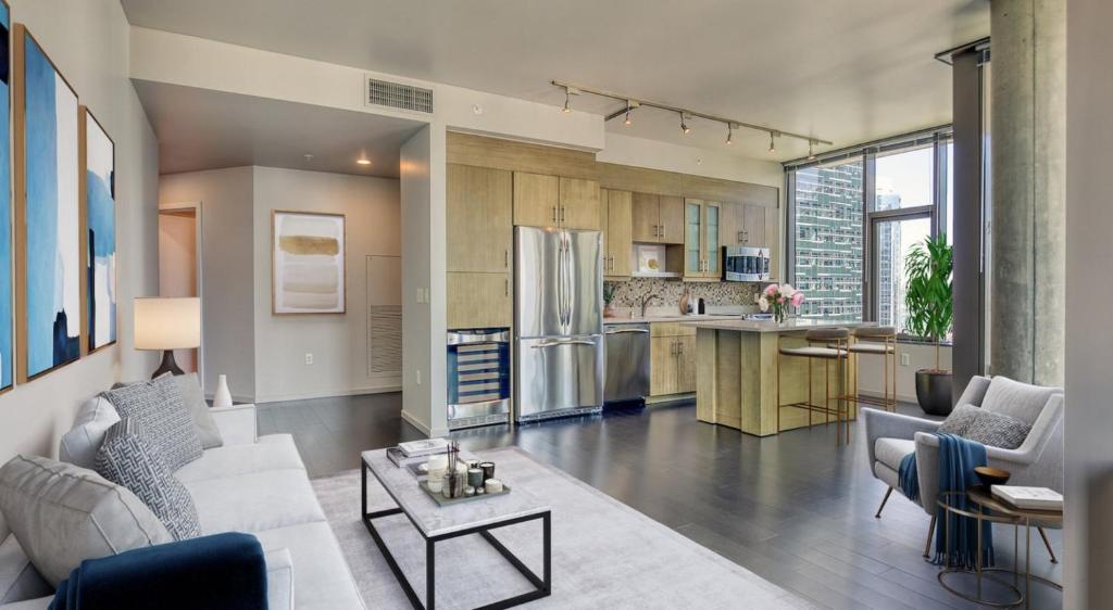 a kitchen and living room with a refrigerator at Via 6 in Seattle