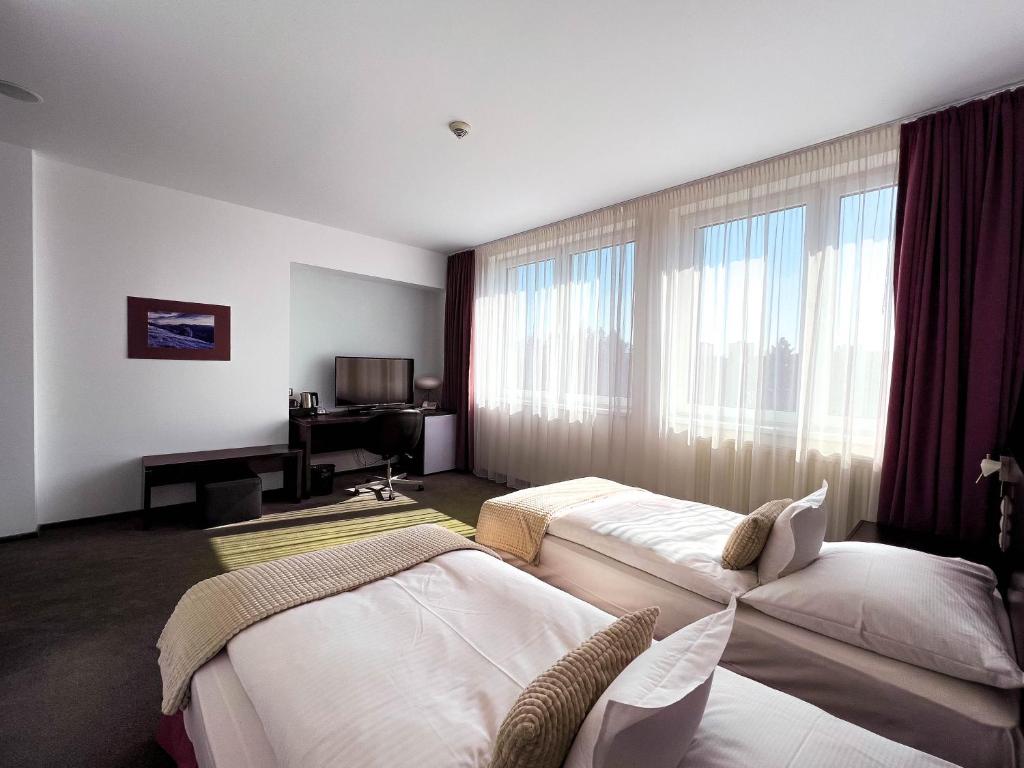 Postel nebo postele na pokoji v ubytování Hotel Turiec