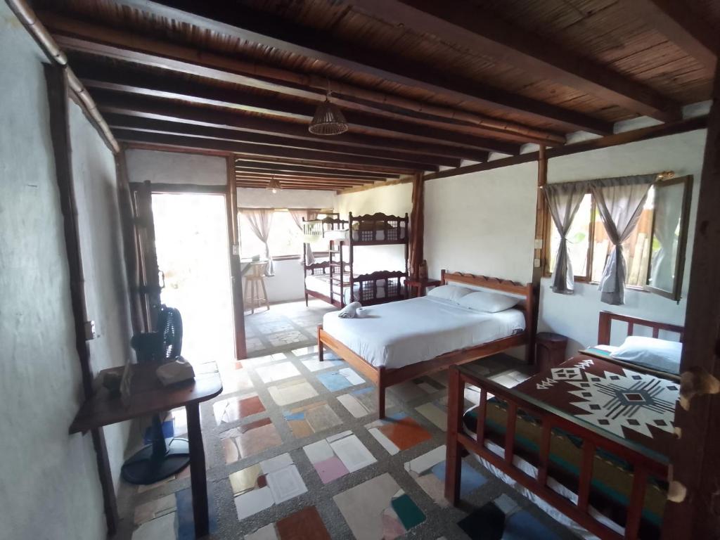 Postel nebo postele na pokoji v ubytování Hotel Palma Coco