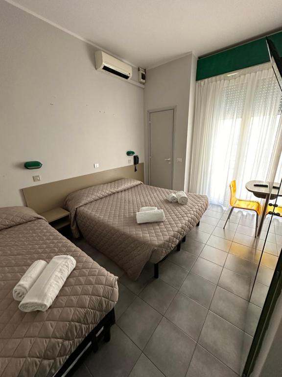 Postel nebo postele na pokoji v ubytování Hotel Austria