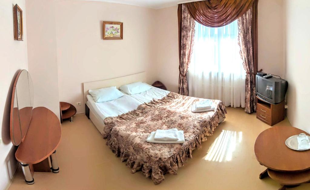 Postel nebo postele na pokoji v ubytování Hotel Complex Knyaz Oleg
