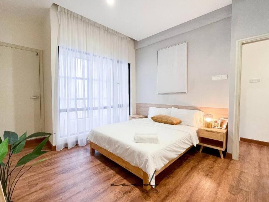a bedroom with a bed and a large window at Muji Style 2-bedrooms Arte Mont Kiara Kuala Lumpur in Kuala Lumpur