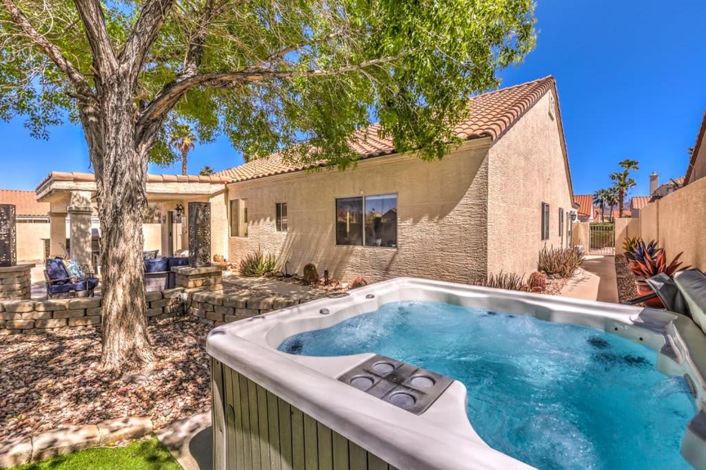 a swimming pool in front of a house at Family Fun for Everyone in Las Vegas- 4 Bedrooms, Billiards, Game Room in Las Vegas