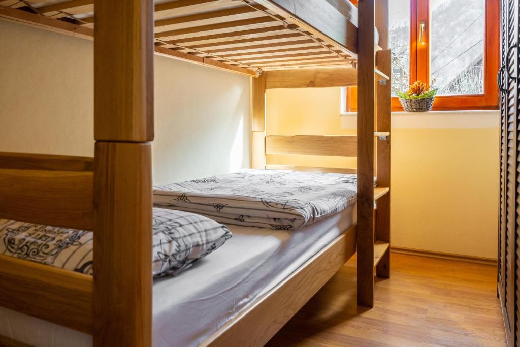 a bunk bed room with two bunk beds at Holiday house Kajfes in Brod na Kupi