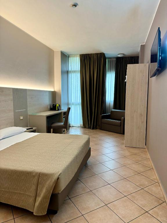 TV a/nebo společenská místnost v ubytování Hotel Miramonti