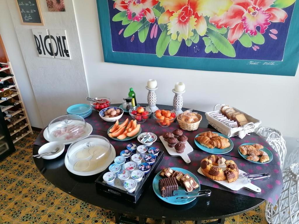 a table with a bunch of food on it at Villa Luisa B&B in Sperlonga