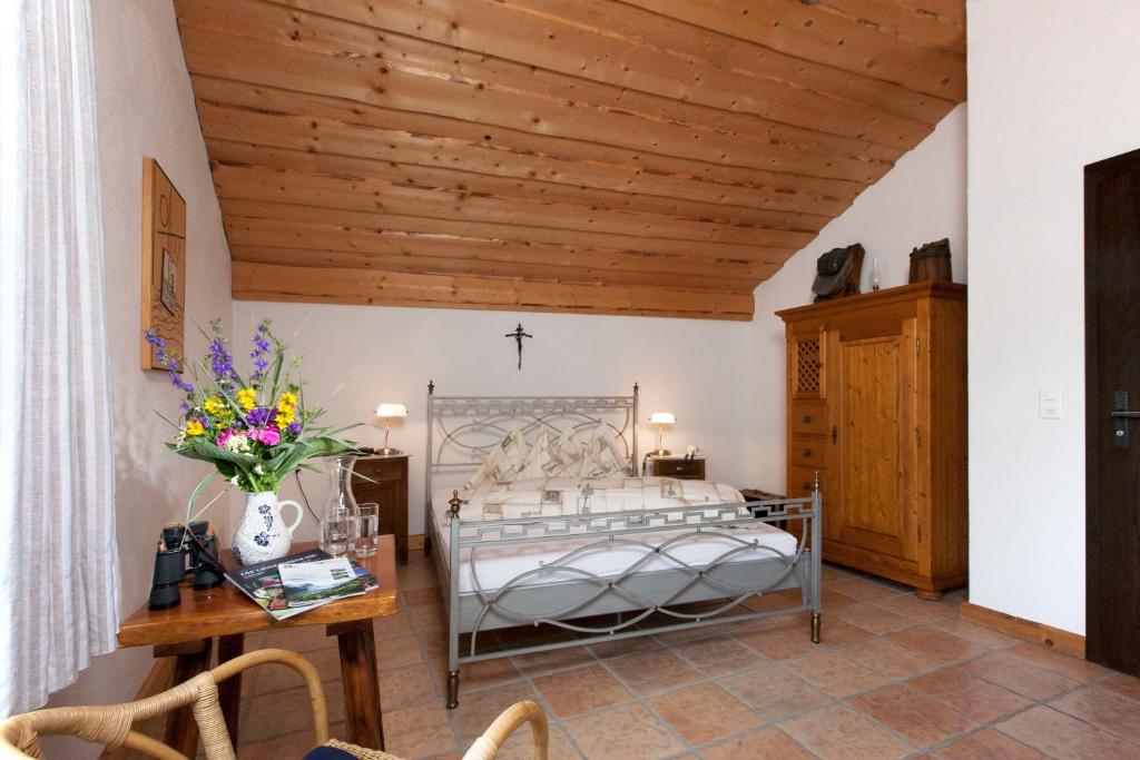 Postel nebo postele na pokoji v ubytování Hotel Arkanum
