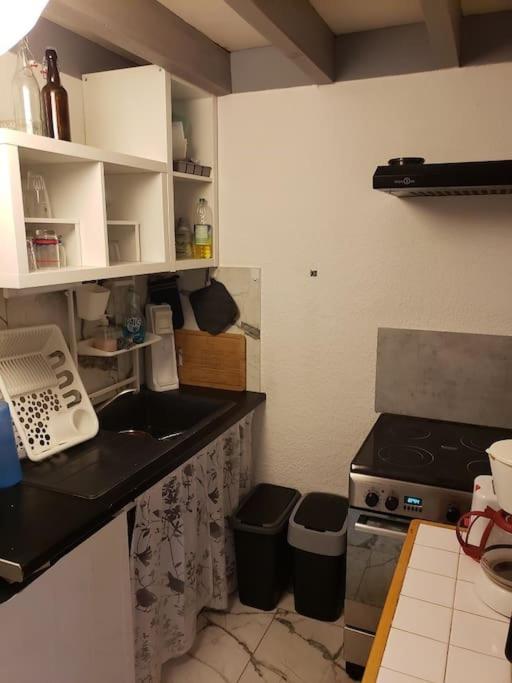 a small kitchen with a sink and a stove at Maison de vacances - 7876 in Soulac-sur-Mer