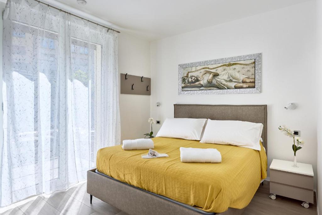 Ένα ή περισσότερα κρεβάτια σε δωμάτιο στο Una finestra al lago