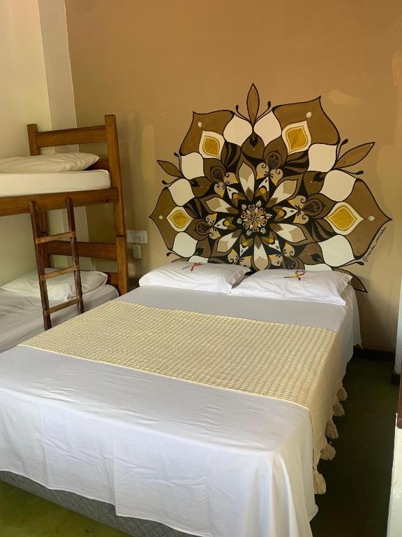 Postel nebo postele na pokoji v ubytování Ôxe Uai Hostel