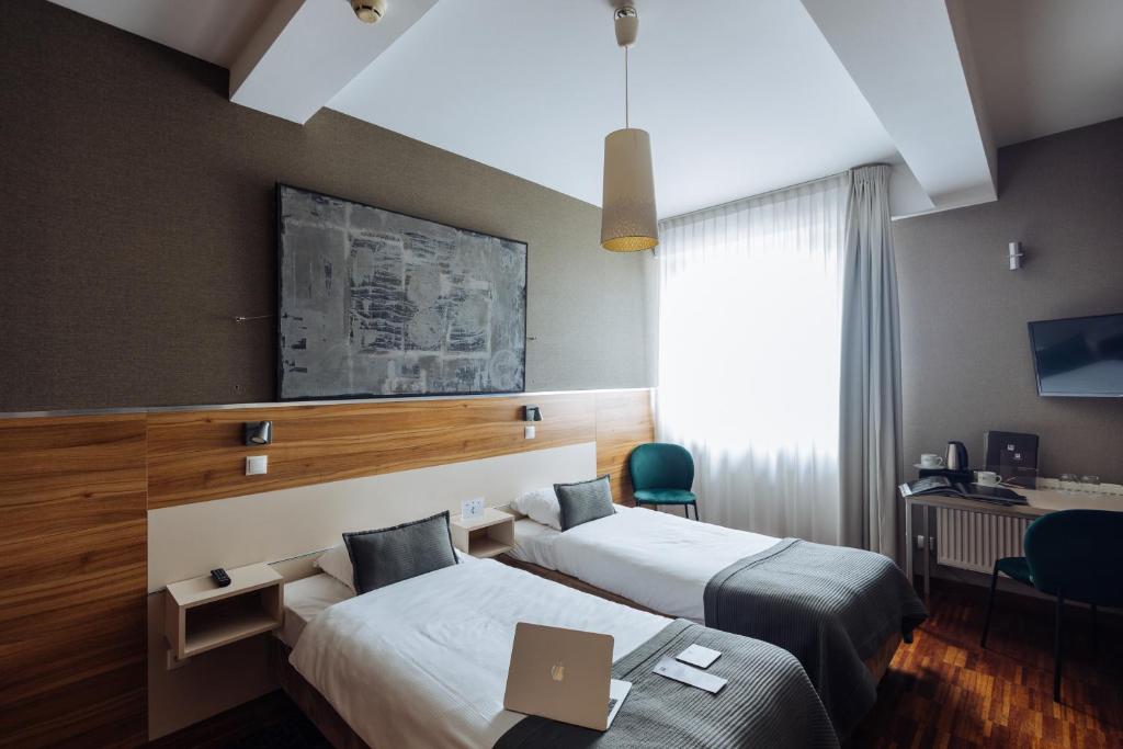 TV a/nebo společenská místnost v ubytování Hotel Beethoven