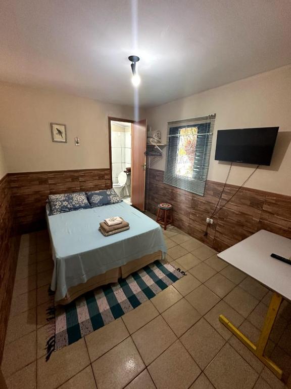Cama ou camas em um quarto em Casa di Vó