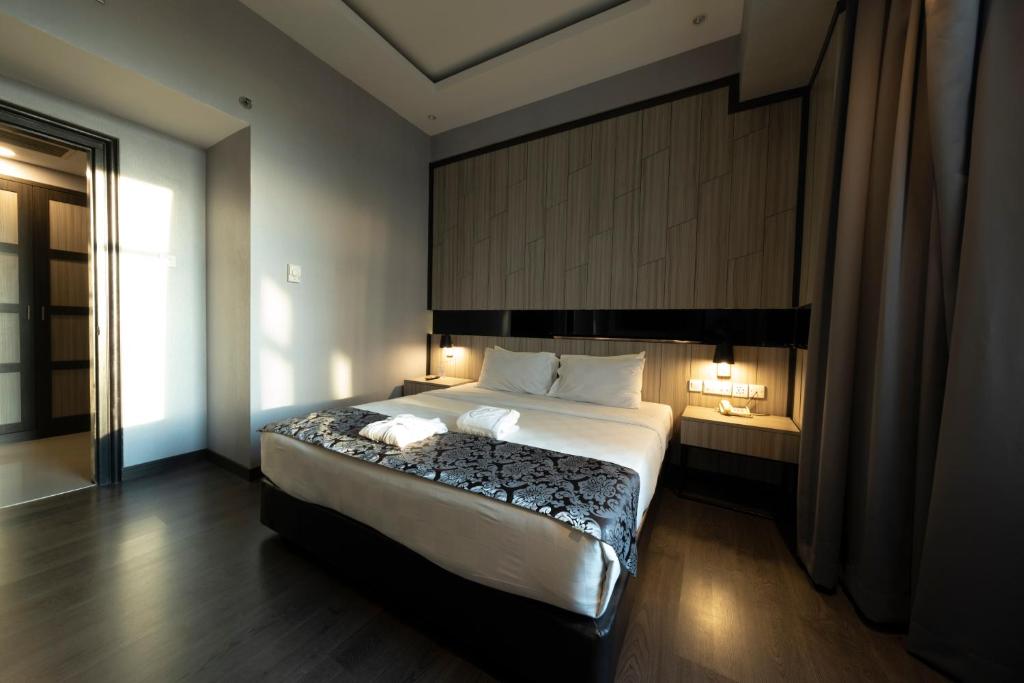 Postel nebo postele na pokoji v ubytování Grand Jatra Hotel Pekanbaru