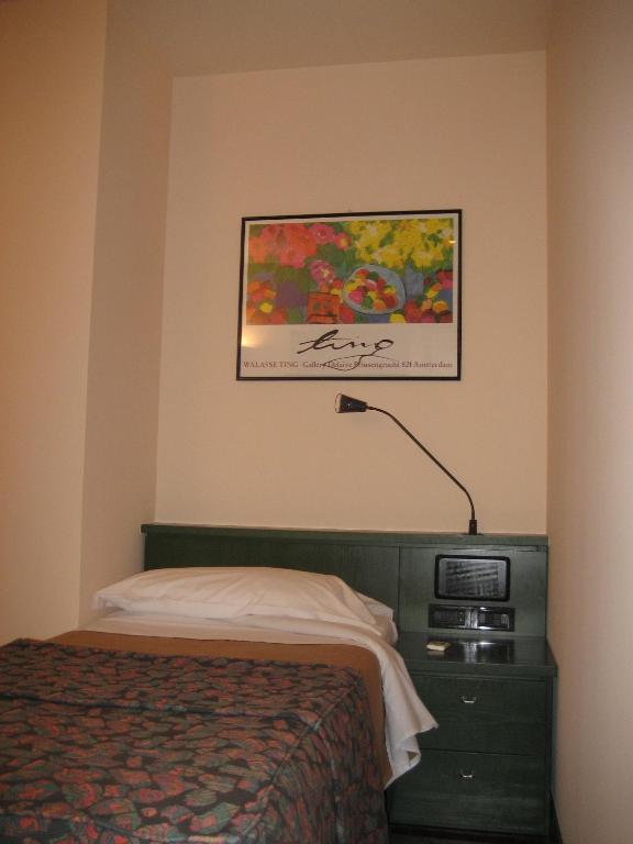 Postel nebo postele na pokoji v ubytování Hotel Del Riale