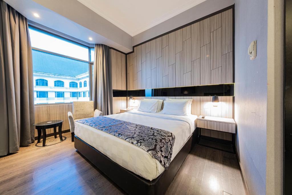 Postel nebo postele na pokoji v ubytování Grand Jatra Hotel Pekanbaru