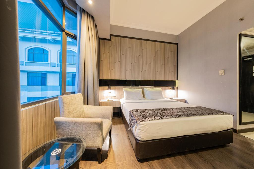Postel nebo postele na pokoji v ubytování Grand Jatra Hotel Pekanbaru