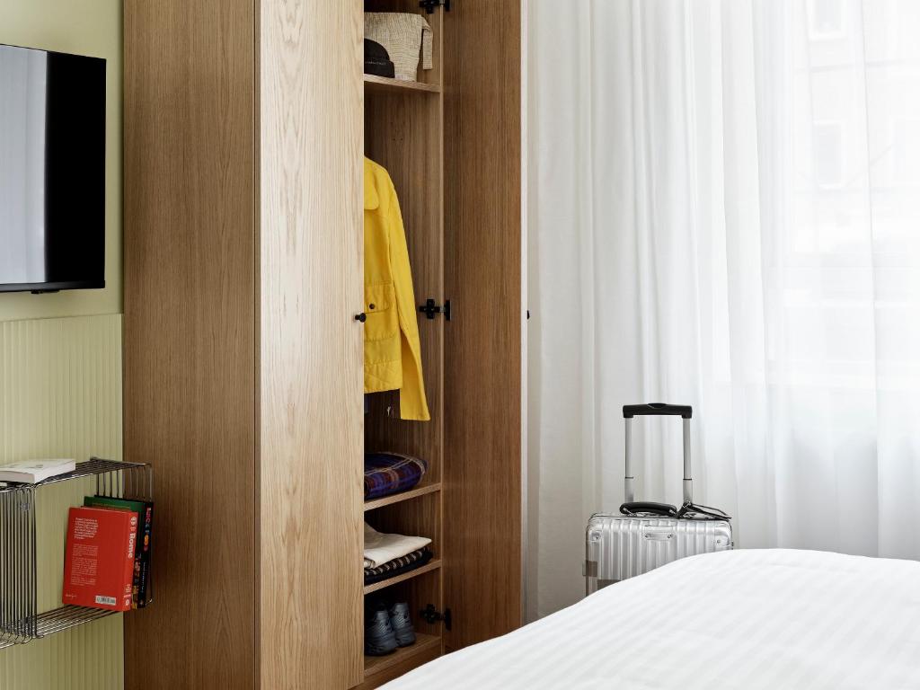 TV a/nebo společenská místnost v ubytování BRIK Apartment Hotel