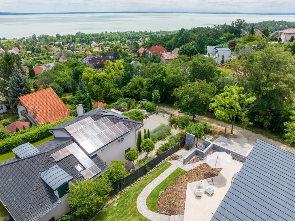 an aerial view of a house with solar panels on its roof at Hillside Home in Balatonalmádi