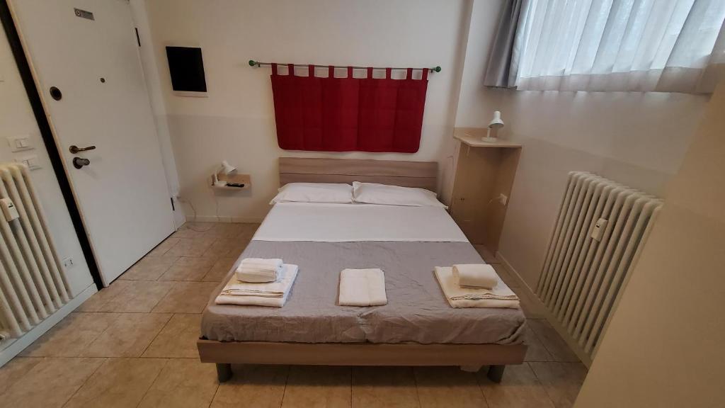 Postel nebo postele na pokoji v ubytování HB Bonomelli 15