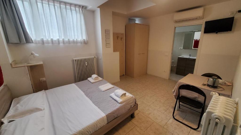 Postel nebo postele na pokoji v ubytování HB Bonomelli 15