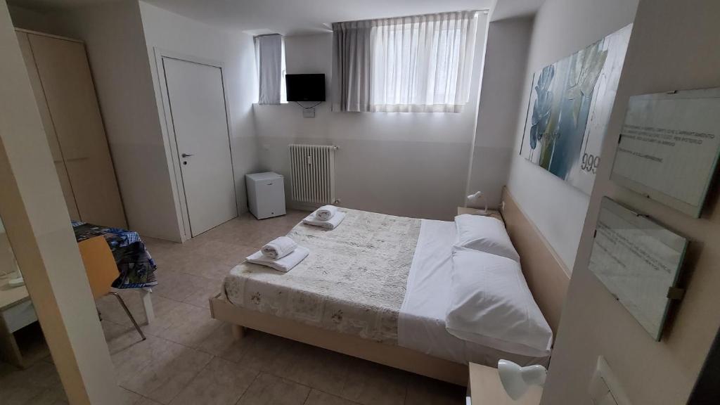 Postel nebo postele na pokoji v ubytování HB Bonomelli 15